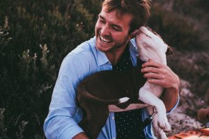 man bonding with his dog